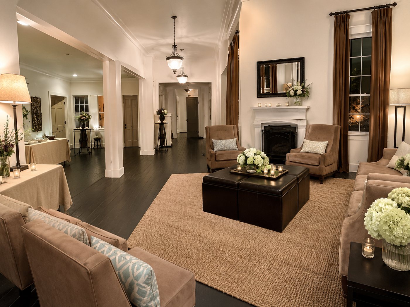 The living area at The Mission House, set with lamps and flowers